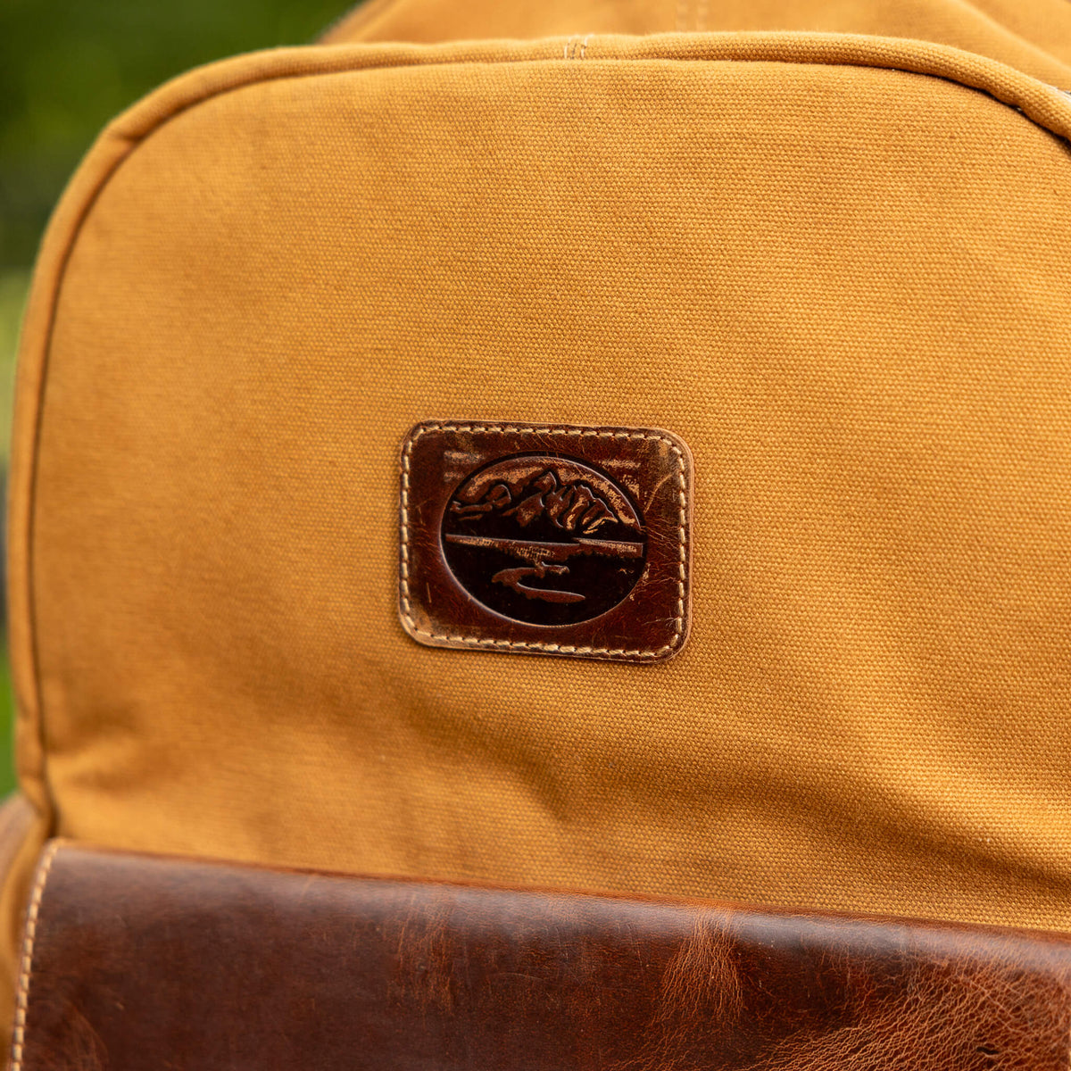 Leather Trimmed Canvas Backpack