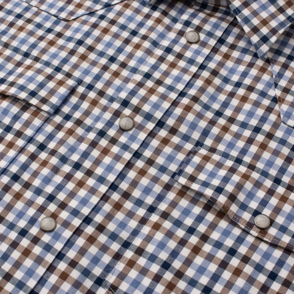 Close-up of men's Bisley Western shirt in blue, brown and white check with pearl snaps
