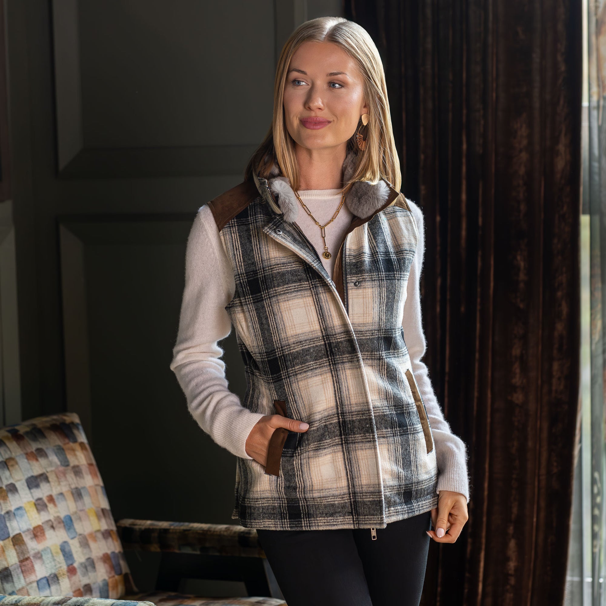 Model wearing the Cashiers wool blend vest with rabbit fur collar, zipped and snapped closed, front view.